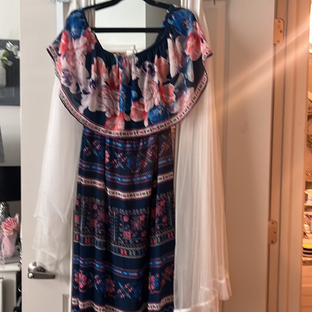 Maxi dress embrorded print with navy background,can be worn on or off shoulder.